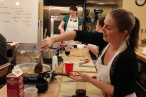 A woman cooking during classes at Culinaerie.