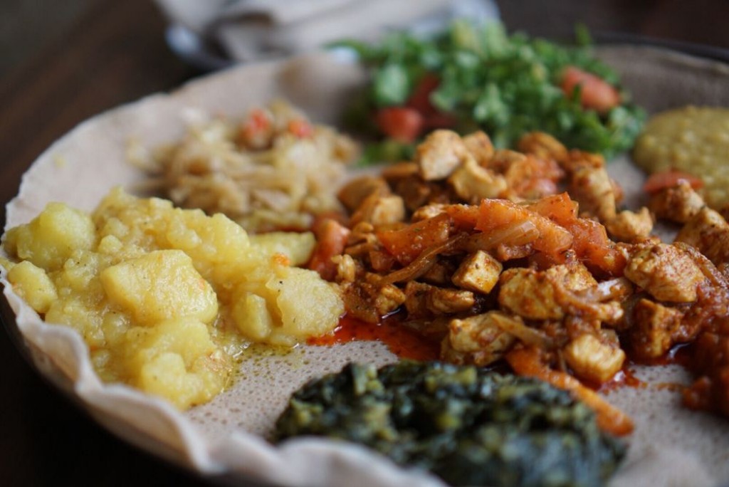 A plate full of African dishes served at a restaurant.
