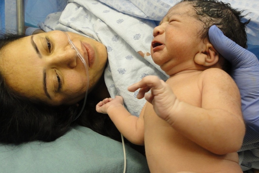 A newborn and its mom.