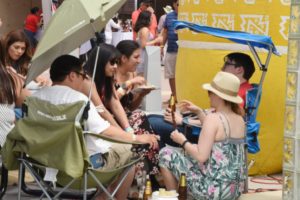 People sitting in chairs eating