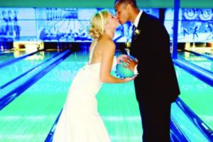 Wedding couple at a bowling alley.