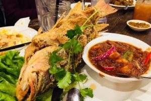 Fried fish on a white plate