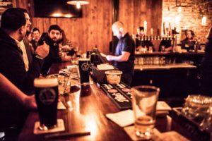 People hanging out at a bar