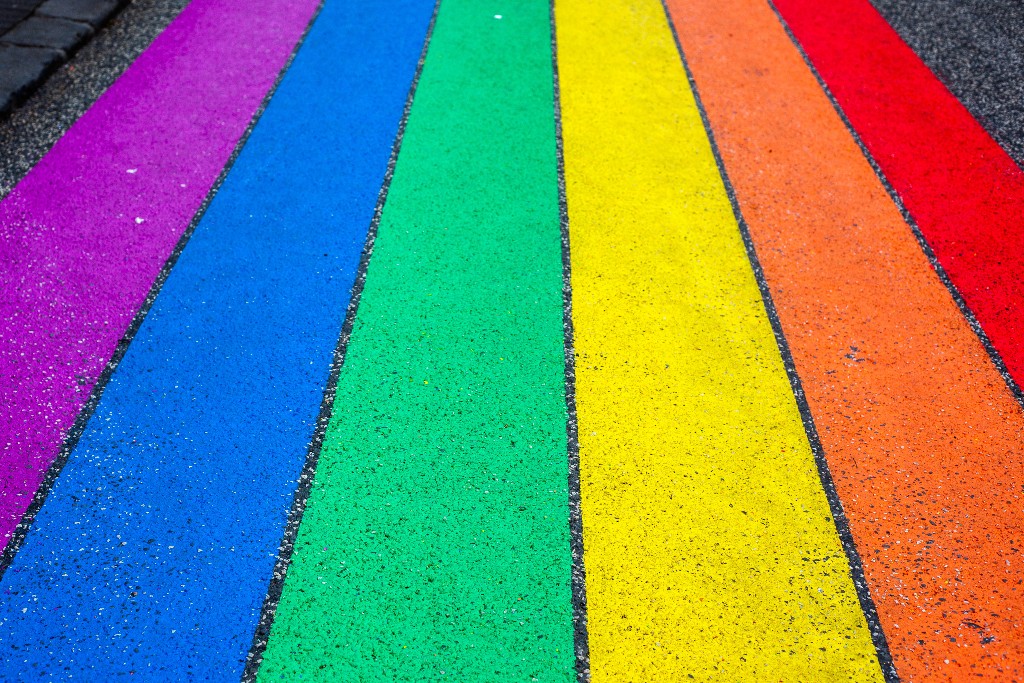 Colors of the LGBTQ Pride flag on the street.