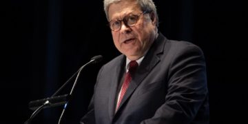 US Attorney General William Barr speaking at an event.