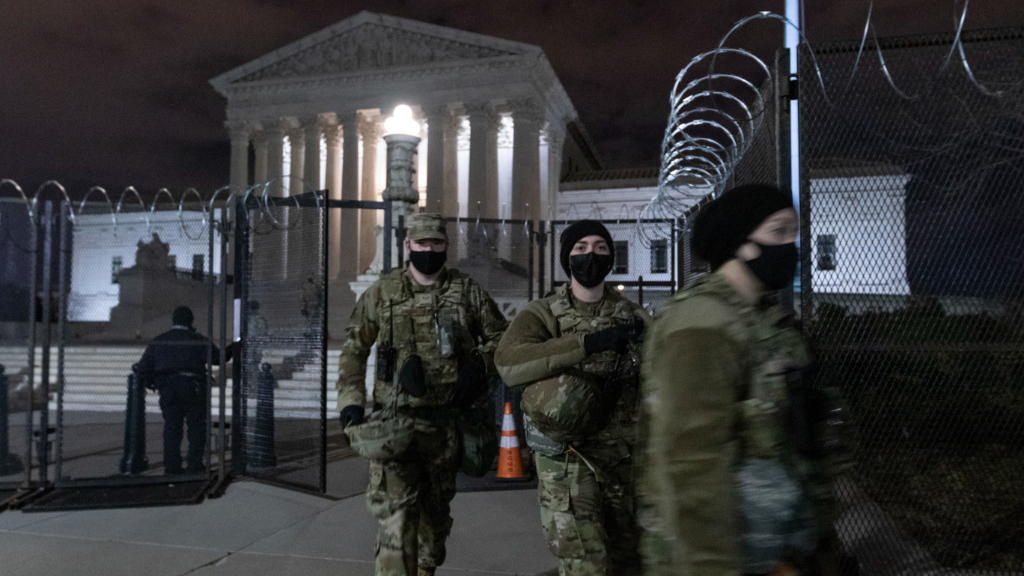 Airmen and soldiers with the Alaska National Guard assist local forces near the Supreme Court in DC, January 23, 2021