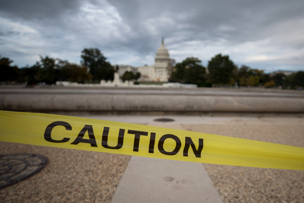 Caution sign at US Capitol, police tape