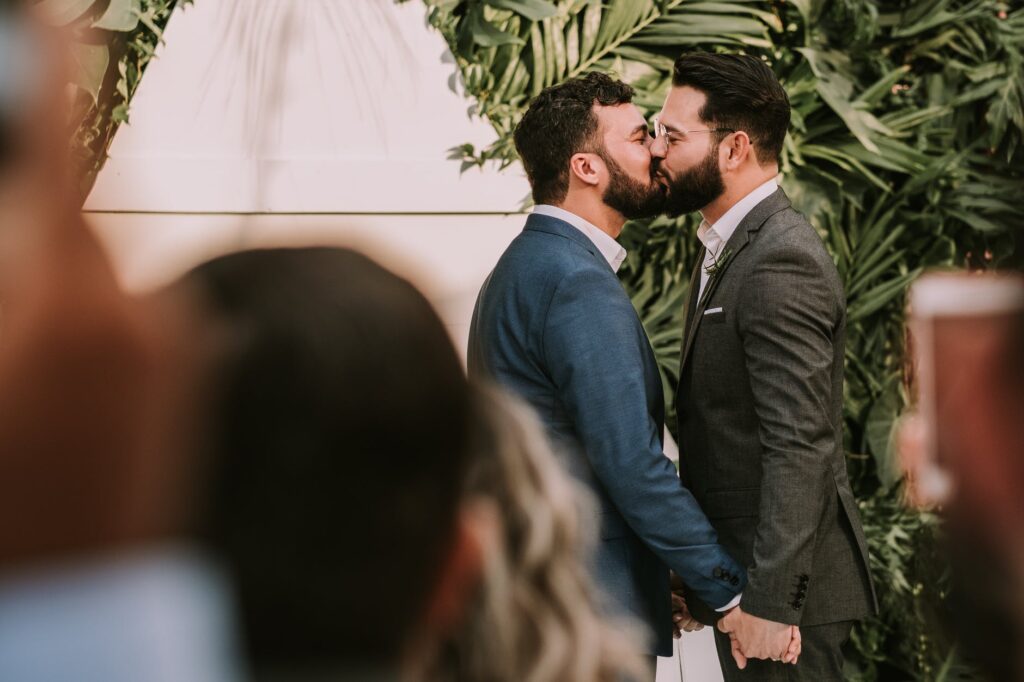 Two guys kissing