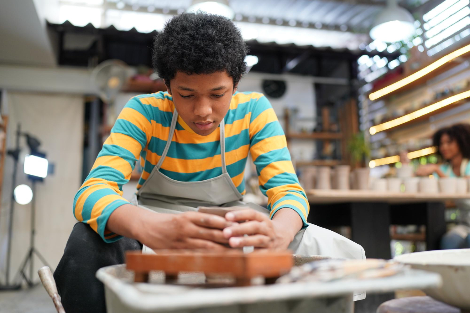 Student working on a piece at a pottery class in Washington DC